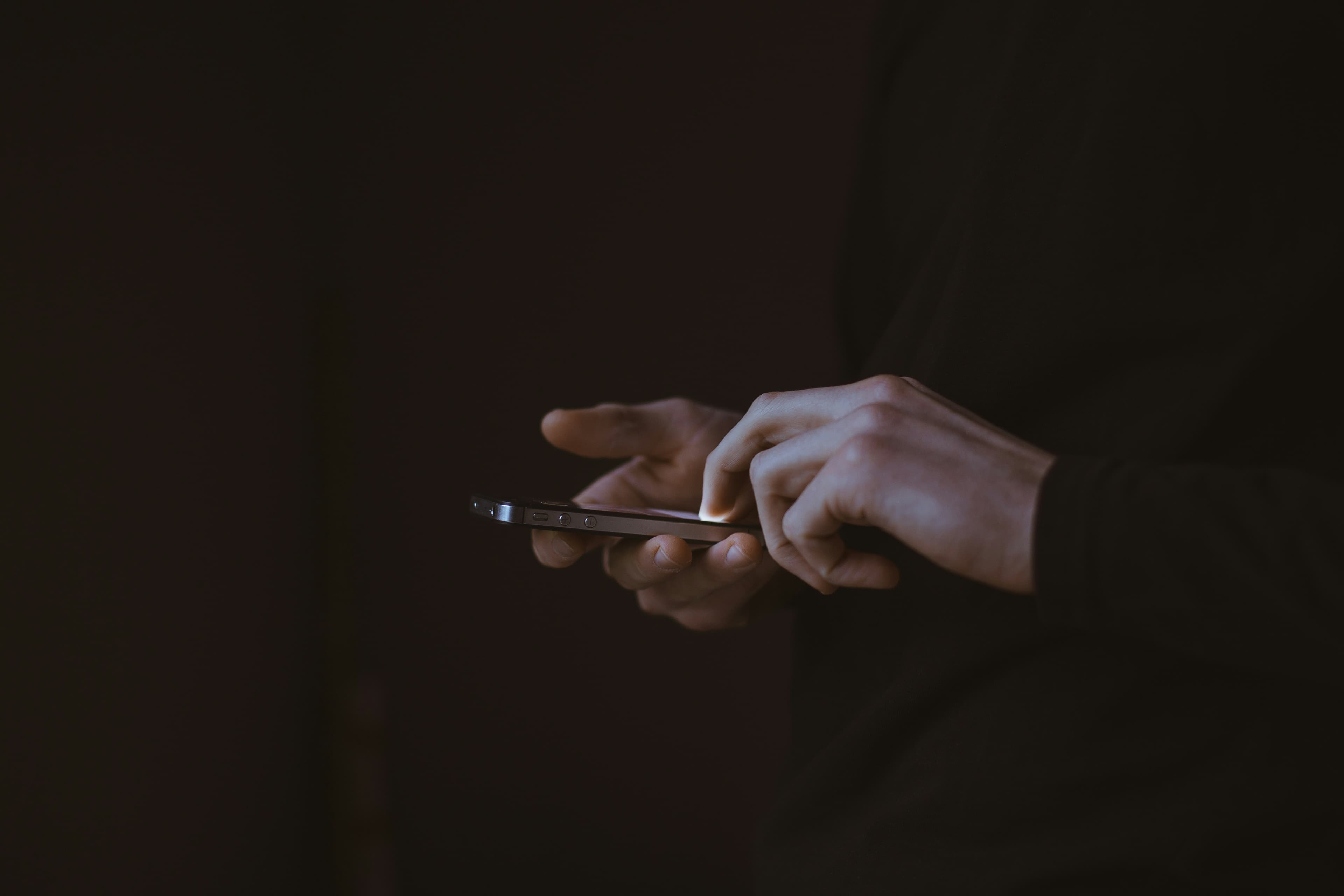 Restaurant staff at peak time keeping up with WhatsApp orders on their phone
